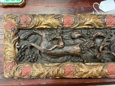 Lot 1510 - Antique, probably 17th century, carved oak frieze, depicting putto and mythical creatures, presented in a gilt and painted moulded frame, 15.5cm x 47.5cm