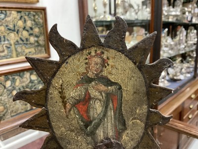 Lot 1513 - 19th century, or earlier, painted metal double-sided table screen depicting figures within a sunburst, on circular base