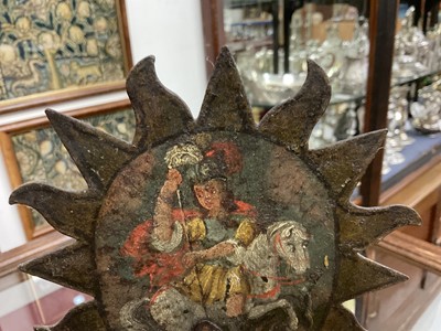 Lot 1513 - 19th century, or earlier, painted metal double-sided table screen depicting figures within a sunburst, on circular base