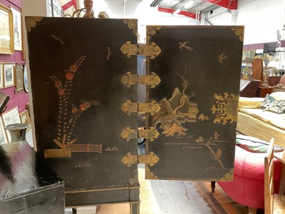 Lot 1522 - Late 17th / early 18th century Chinese lacquer cabinet on stand, the twin hinged doors decorated with landscapes, brass strap hinges, enclosing an arrangment of drawers, on square legs