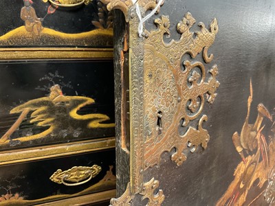Lot 1522 - Late 17th / early 18th century Chinese lacquer cabinet on stand, the twin hinged doors decorated with landscapes, brass strap hinges, enclosing an arrangment of drawers, on square legs