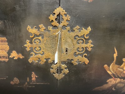 Lot 1522 - Late 17th / early 18th century Chinese lacquer cabinet on stand, the twin hinged doors decorated with landscapes, brass strap hinges, enclosing an arrangment of drawers, on square legs