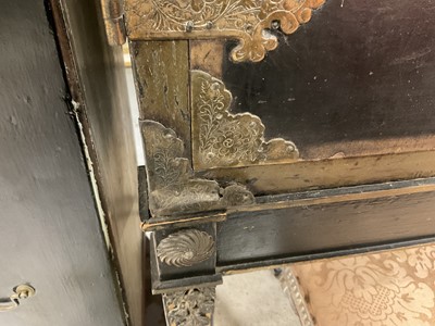 Lot 1522 - Late 17th / early 18th century Chinese lacquer cabinet on stand, the twin hinged doors decorated with landscapes, brass strap hinges, enclosing an arrangment of drawers, on square legs