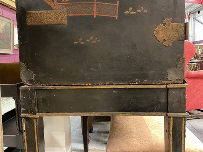 Lot 1522 - Late 17th / early 18th century Chinese lacquer cabinet on stand, the twin hinged doors decorated with landscapes, brass strap hinges, enclosing an arrangment of drawers, on square legs