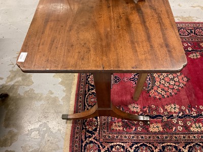 Lot 1526 - George IV mahogany table with shaped rectangular top above straight supports on splayed legs and brass capped castors, 91cm wide