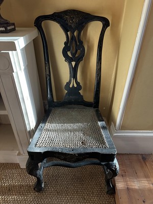 Lot 1557 - 18th century parcel gilt ebonised side chair, the openwork back with pieced scrollwork splat, gilt cartouche to cresting and apron, cane seat and cabriole legs with claw and ball feet with shape...