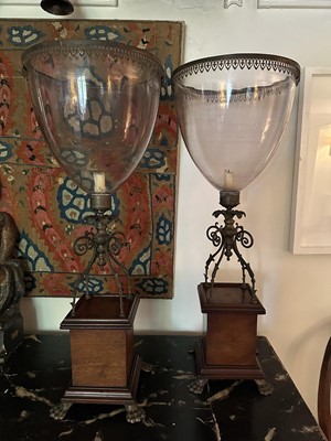 Lot 1597 - Good pair of 19th century hurricane lanterns, the glass shades with gilt metal mounts, on scroll gilt brass supports, mahogany plinth bases and brass claw feet