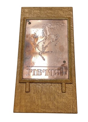 Lot 8 - Ferrari interest- polished copper printing plate, used to produce the embossed cover of the official 1988 Ferrari UK calendar, mounted in an oak frame, the printing plate 25.5 x 17.5cm, 45 x 23c...