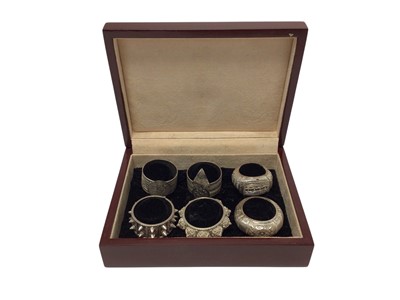 Lot 350 - Cased set of six Omani silver napkin rings, of elaborate design, stamped 92.5