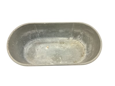 Lot 1874 - Antique painted tin plant trough of tapered elongated oval form, 72cm wide