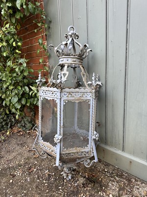 Lot 1925 - Antique wrought iron and painted garden lantern of hexagonal form with elaborate acanthus leaf ornament and glazed sides, 120cm high. Provenance: believed to have been removed from a Roth...