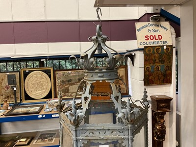 Lot 1925 - Antique wrought iron and painted garden lantern of hexagonal form with elaborate acanthus leaf ornament and glazed sides, 120cm high. Provenance: believed to have been removed from a Roth...