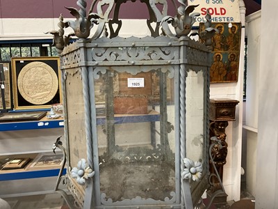 Lot 1925 - Antique wrought iron and painted garden lantern of hexagonal form with elaborate acanthus leaf ornament and glazed sides, 120cm high. Provenance: believed to have been removed from a Roth...
