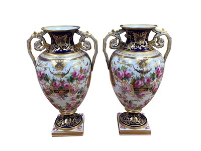 Lot 5013 - Pair of Copeland urn shaped vases, painted with roses, on a cobalt blue and gilt ground