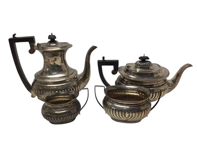 Lot 364 - Three-piece silver tea and similar pattern coffee pot