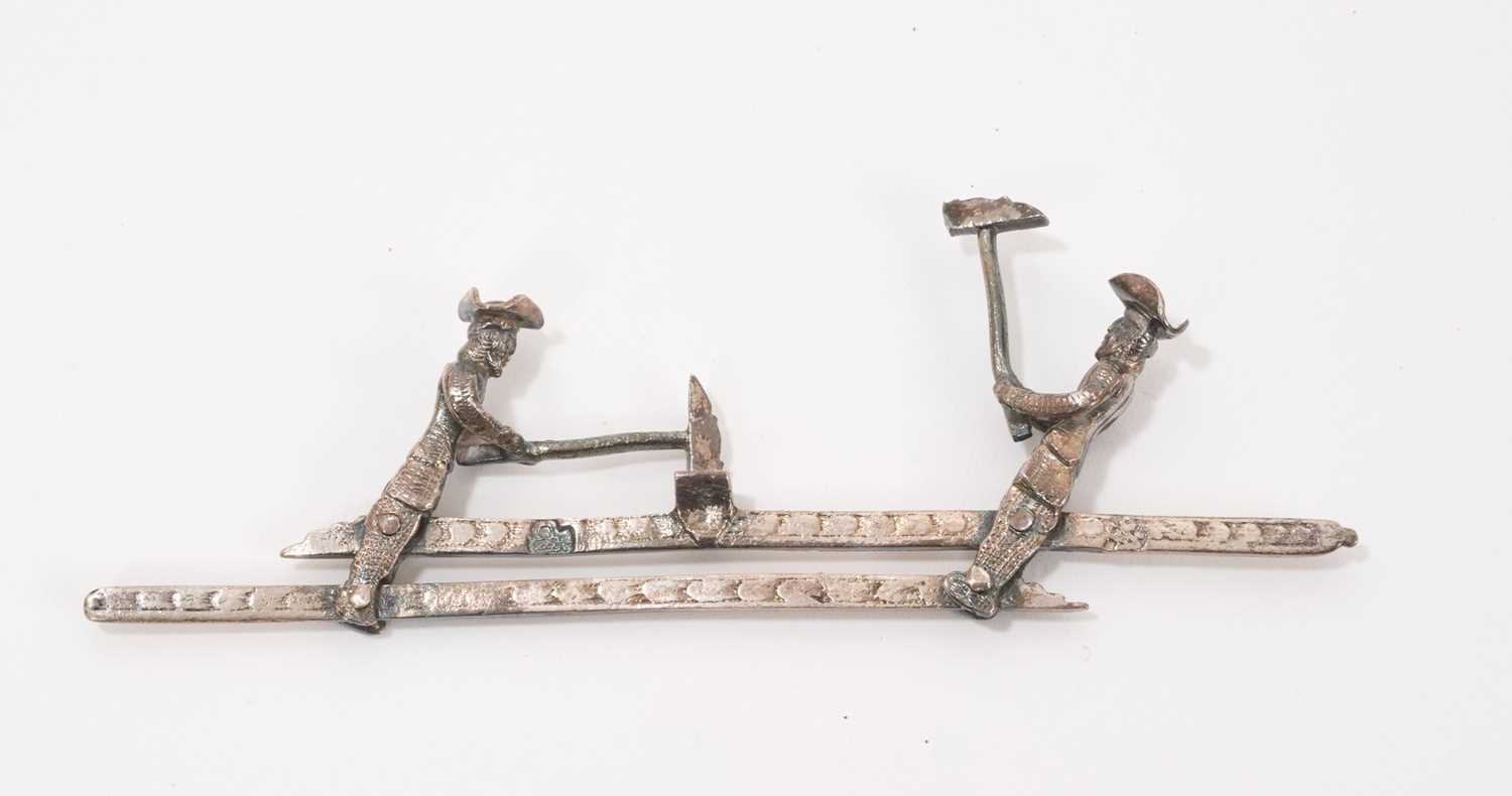 Lot 852 - Dutch silver mechanical toy, of two woodcutters, 11cm wide, Amsterdam mark