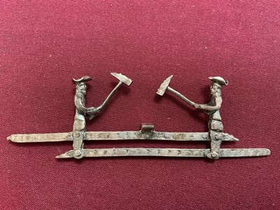 Lot 852 - Dutch silver mechanical toy, of two woodcutters, 11cm wide, Amsterdam mark