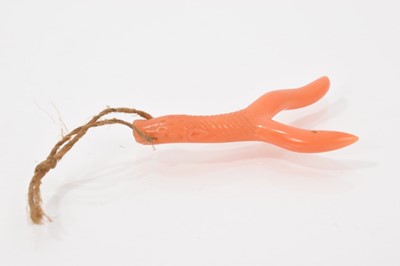 Lot 503 - Antique Chinese coral pendant carved with a horse head, the mane spreading down the stem to forked terminals, 42mm