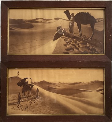 Lot 141 - Lehnert & Landrock, Desert, Camels and Figures, pair toned gelatine silver panoramic prints, period oak frames with gilt slip...