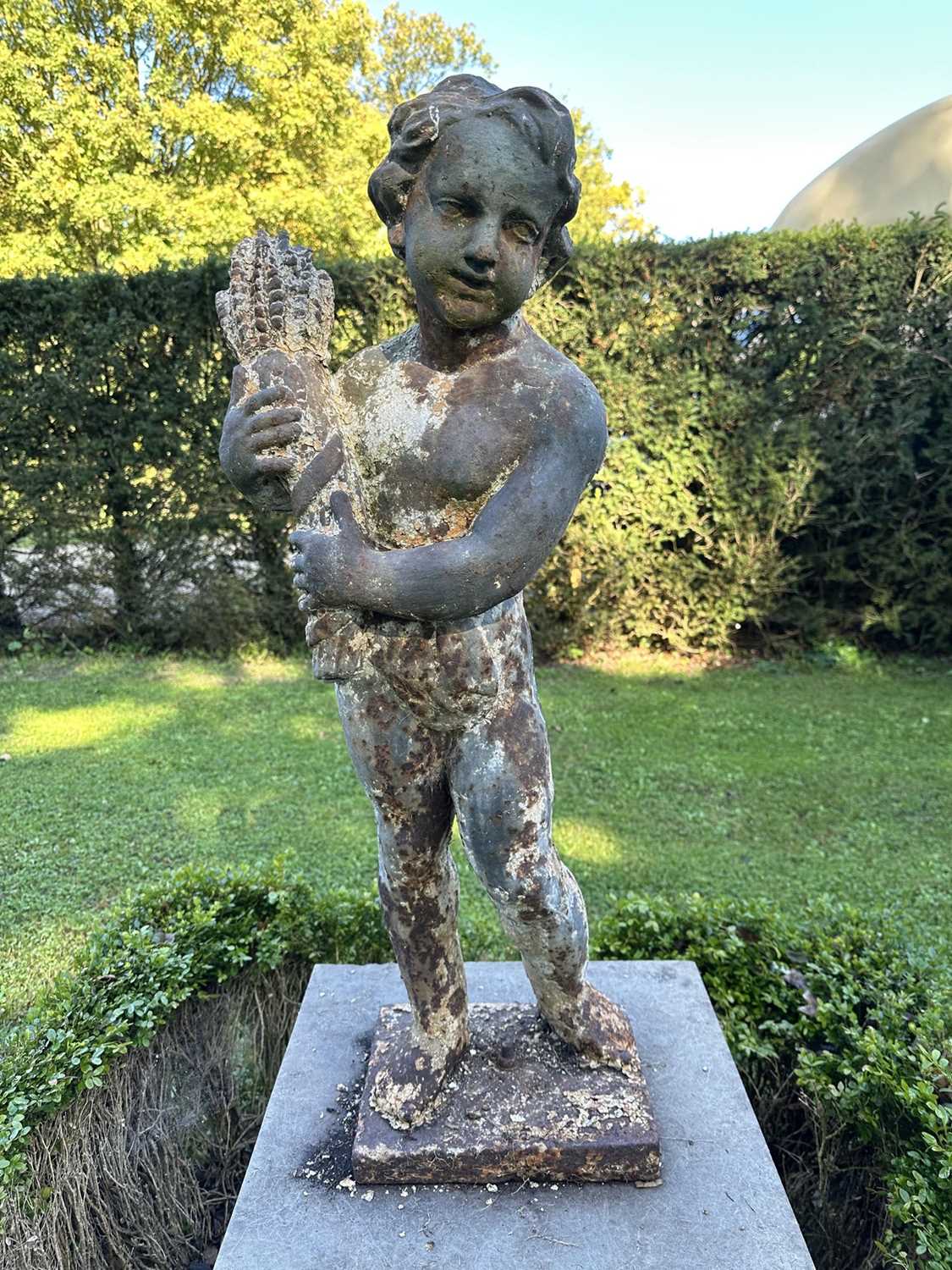 Lot 1927 - Pair of Victorian cast iron garden figures of the seasons, on square bases, 96cm high overall