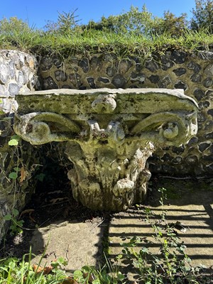 Lot 1930 - Pair of 18th century English carved stone classical capitals with scrolling mounts, later applied lead tops, 52cm high overall