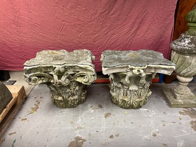 Lot 1930 - Pair of 18th century English carved stone classical capitals with scrolling mounts, later applied lead tops, 52cm high overall