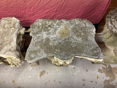 Lot 1930 - Pair of 18th century English carved stone classical capitals with scrolling mounts, later applied lead tops, 52cm high overall