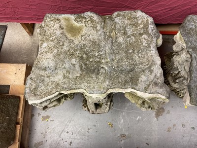 Lot 1930 - Pair of 18th century English carved stone classical capitals with scrolling mounts, later applied lead tops, 52cm high overall