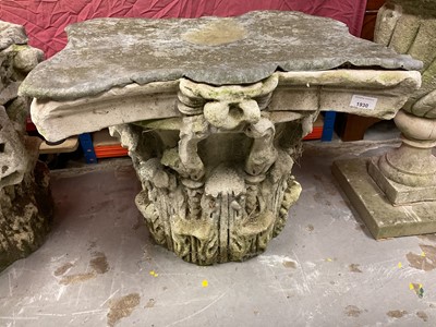 Lot 1930 - Pair of 18th century English carved stone classical capitals with scrolling mounts, later applied lead tops, 52cm high overall