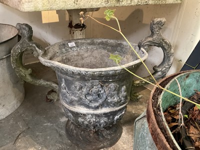 Lot 1932 - 18th / 19th century lead planter, classical form with twin scroll mythical formed handles, on circular base, 54cm high overall
