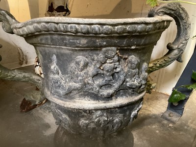 Lot 1932 - 18th / 19th century lead planter, classical form with twin scroll mythical formed handles, on circular base, 54cm high overall