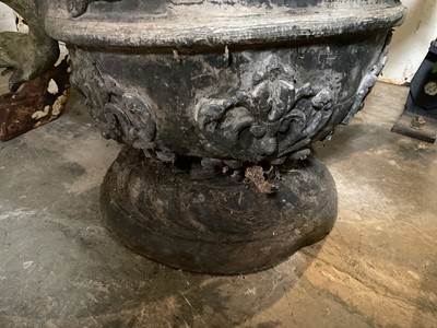 Lot 1932 - 18th / 19th century lead planter, classical form with twin scroll mythical formed handles, on circular base, 54cm high overall