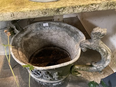Lot 1932 - 18th / 19th century lead planter, classical form with twin scroll mythical formed handles, on circular base, 54cm high overall
