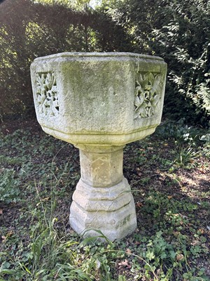 Lot 1940 - Good antique carved stone font of octagonal form with four leaf carved panels, on octagonal columns and stepped base, 67cm wide x 100cm high