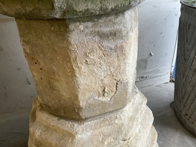 Lot 1940 - Good antique carved stone font of octagonal form with four leaf carved panels, on octagonal columns and stepped base, 67cm wide x 100cm high