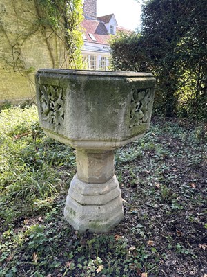 Lot 1940 - Good antique carved stone font of octagonal form with four leaf carved panels, on octagonal columns and stepped base, 67cm wide x 100cm high