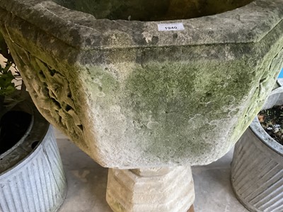 Lot 1940 - Good antique carved stone font of octagonal form with four leaf carved panels, on octagonal columns and stepped base, 67cm wide x 100cm high