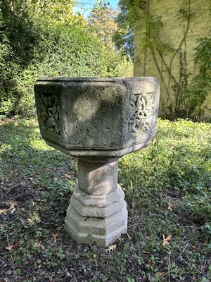 Lot 1940 - Good antique carved stone font of octagonal form with four leaf carved panels, on octagonal columns and stepped base, 67cm wide x 100cm high
