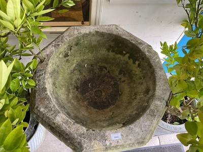 Lot 1940 - Good antique carved stone font of octagonal form with four leaf carved panels, on octagonal columns and stepped base, 67cm wide x 100cm high