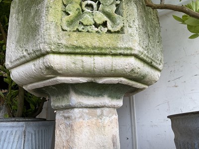 Lot 1940 - Good antique carved stone font of octagonal form with four leaf carved panels, on octagonal columns and stepped base, 67cm wide x 100cm high