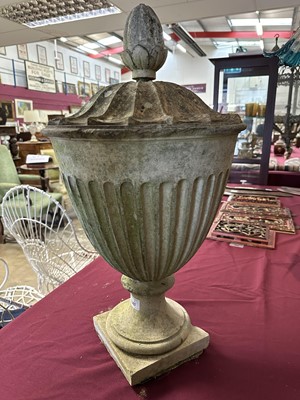 Lot 1941 - Antique Coade stone urn, the foliate knop above a domed cover and fluted body, circular socle and square base, approximately 60cm high
