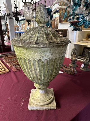 Lot 1941 - Antique Coade stone urn, the foliate knop above a domed cover and fluted body, circular socle and square base, approximately 60cm high
