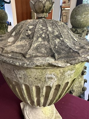 Lot 1941 - Antique Coade stone urn, the foliate knop above a domed cover and fluted body, circular socle and square base, approximately 60cm high