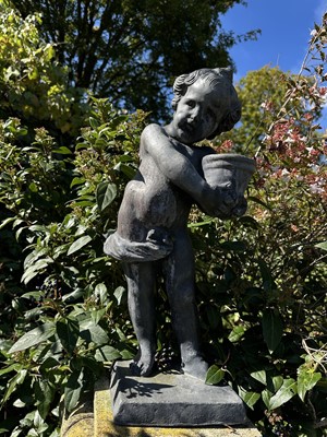 Lot 1945 - Antique lead garden figure depicting a boy holding a pot, 49cm high