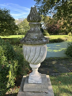 Lot 1949 - Pair of antique garden urns of wrythen fluted form, on square bases and superstate square plinths, 100cm high overall