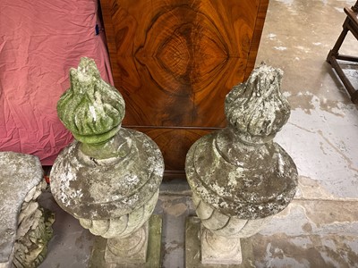 Lot 1949 - Pair of antique garden urns of wrythen fluted form, on square bases and superstate square plinths, 100cm high overall