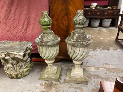 Lot 1949 - Pair of antique garden urns of wrythen fluted form, on square bases and superstate square plinths, 100cm high overall