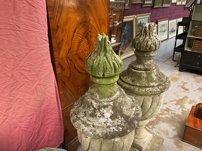 Lot 1949 - Pair of antique garden urns of wrythen fluted form, on square bases and superstate square plinths, 100cm high overall