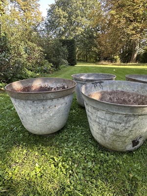 Lot 1950 - Set of eight galvanised garden planters of slightly tapered form, on circular bases, 35cm high