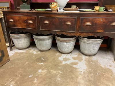 Lot 1950 - Set of eight galvanised garden planters of slightly tapered form, on circular bases, 35cm high